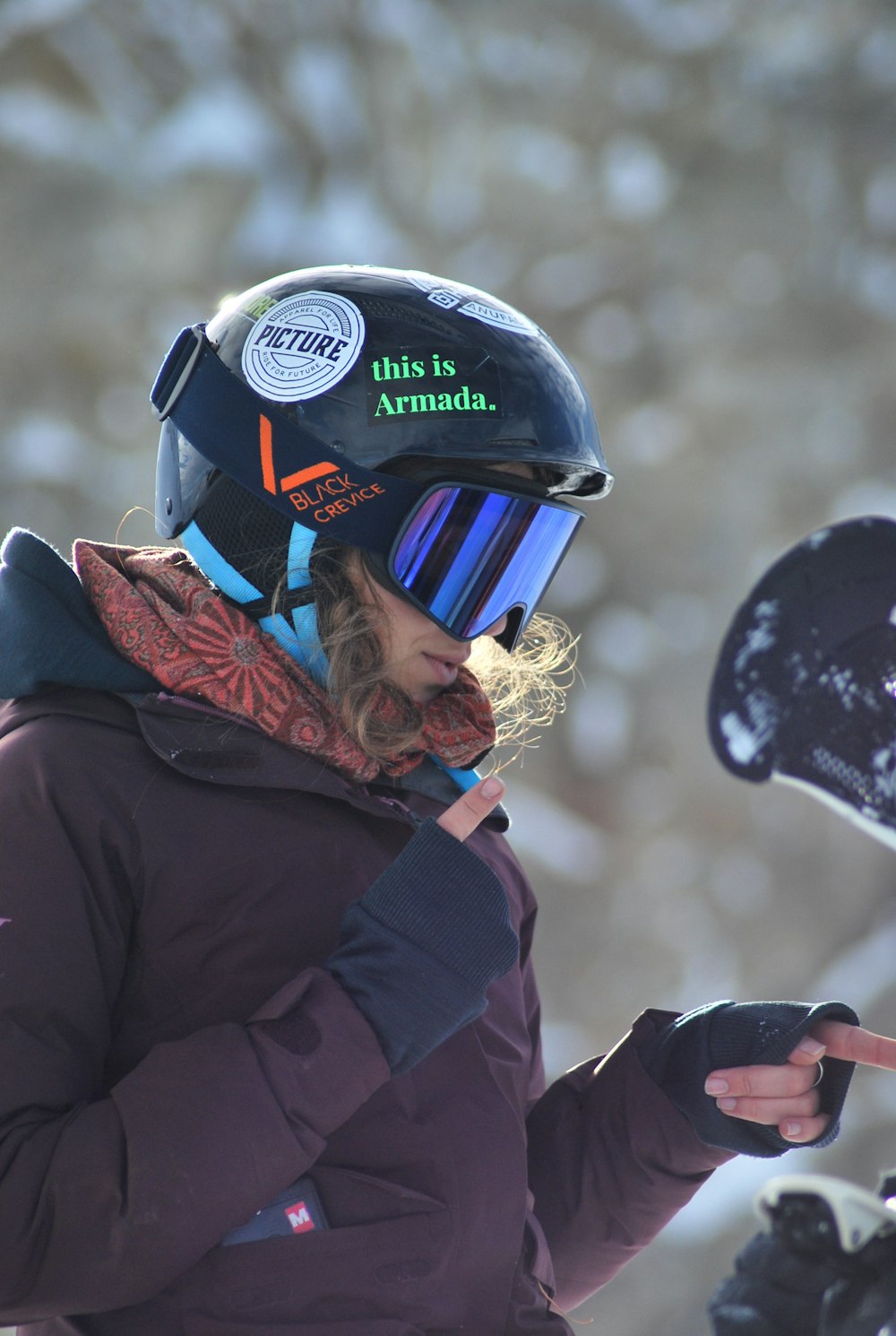 man in black jacket wearing blue helmet