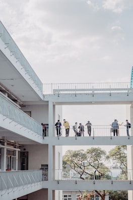 A family enjoying time on a balcony secured with nets.
