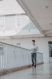 Architect inspecting a newly built house interior with clipboard.