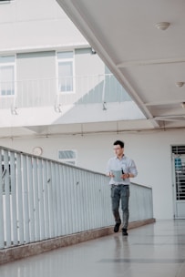 Architect inspecting a newly built house interior with clipboard.