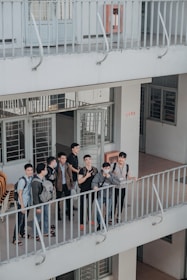 A diverse group of international students discussing their studies in a university setting.