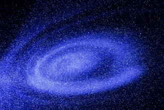 A mesmerizing view of a distant galaxy with swirling stars and nebulae.