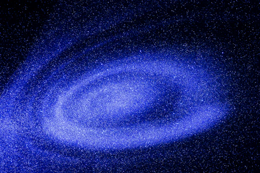 A mesmerizing view of a distant galaxy with swirling stars and nebulae.