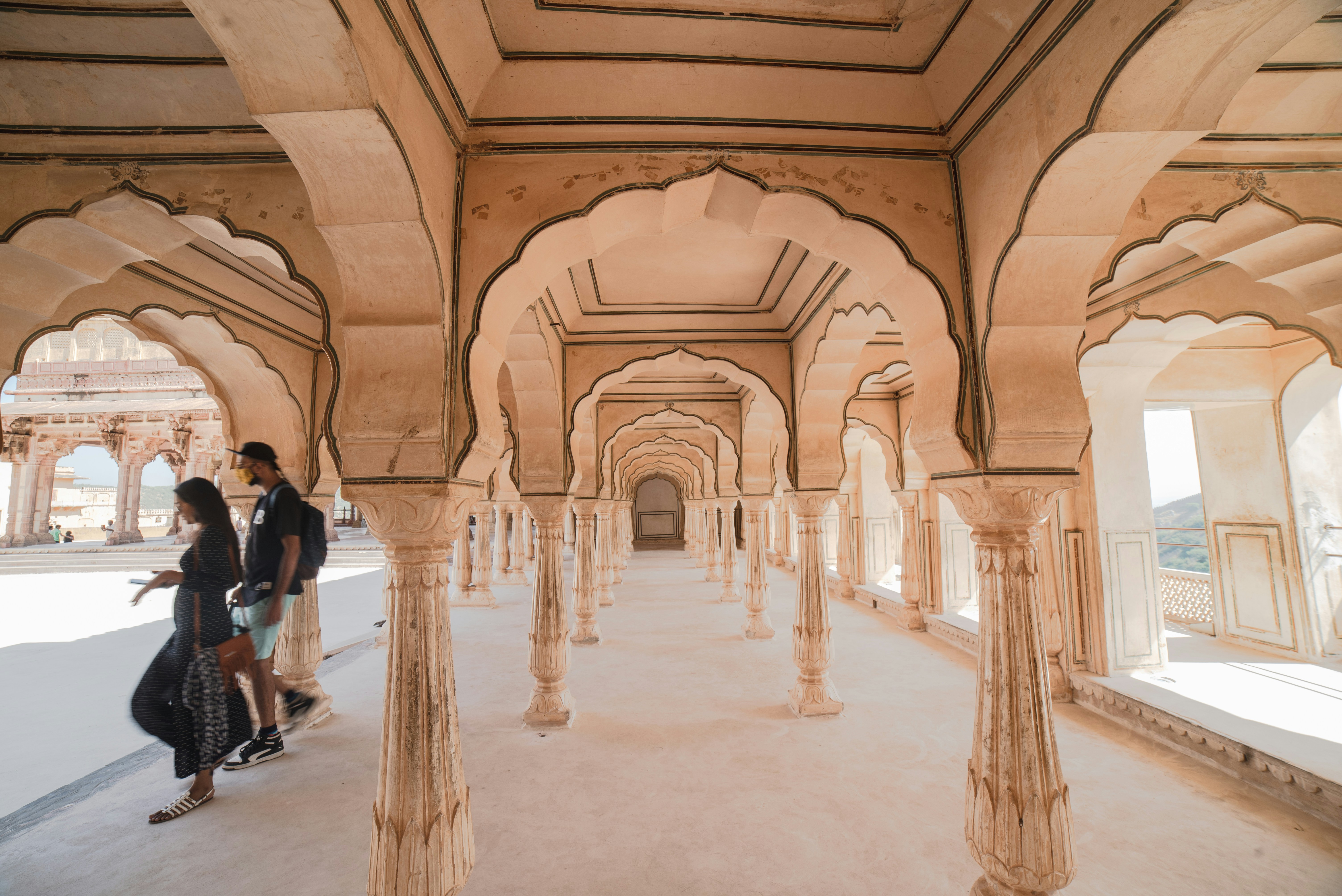 people walking inside brown concrete building