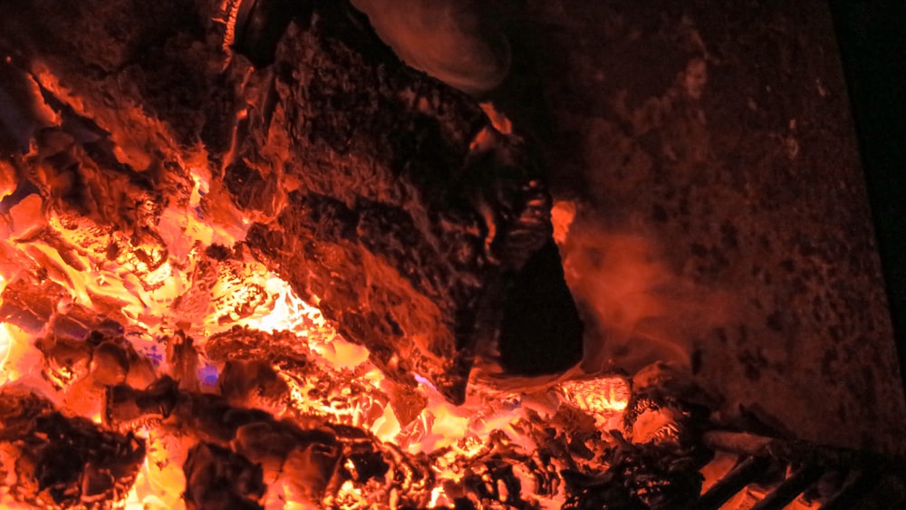 brown and black cave with fire