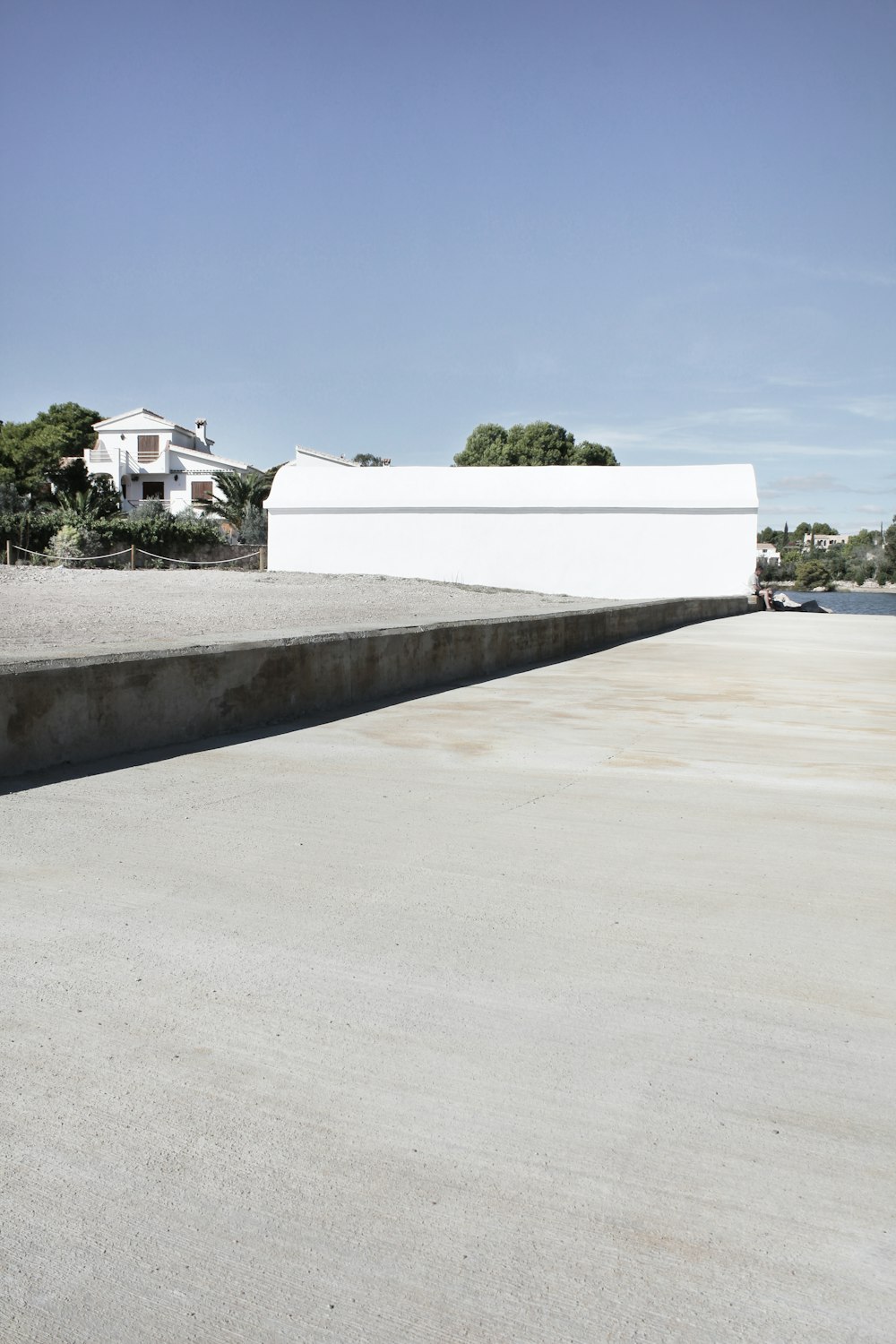 white concrete building near green trees during daytime