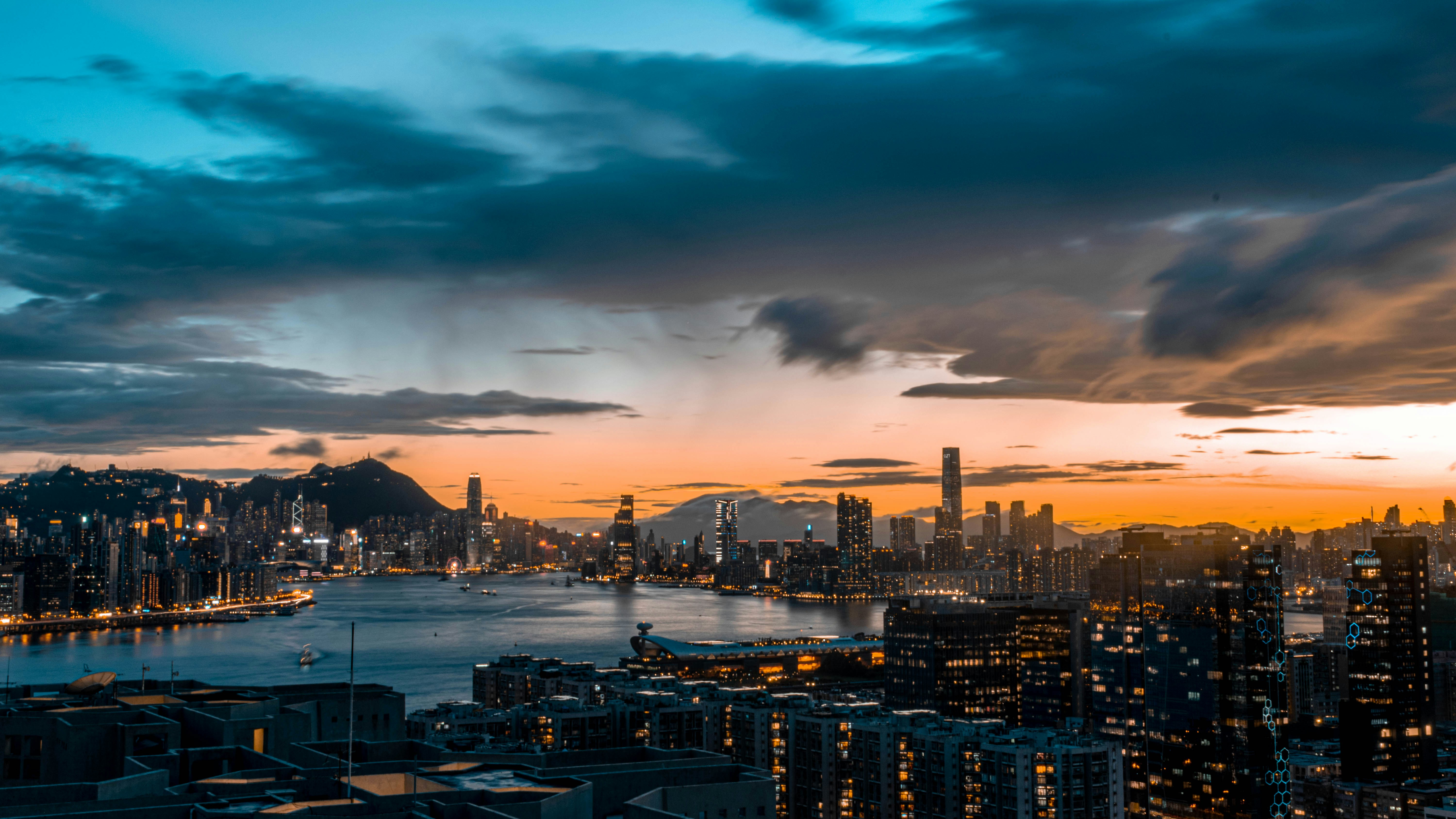 city skyline under cloudy sky during night time, Hong Kong Skyline.
