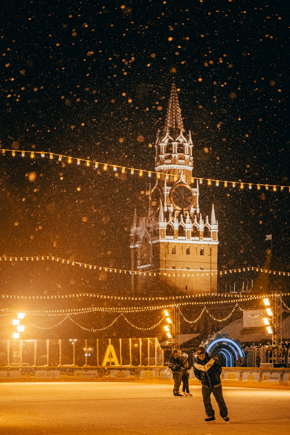 white and blue castle with lights during night time