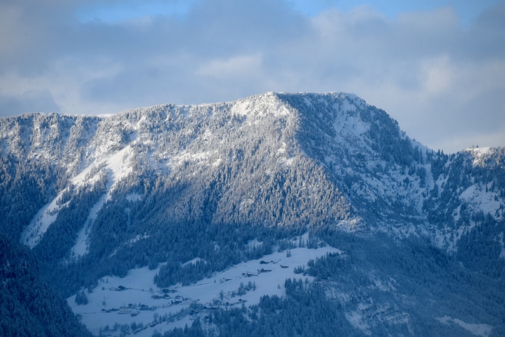 snow covered mountain under blue sky during daytime