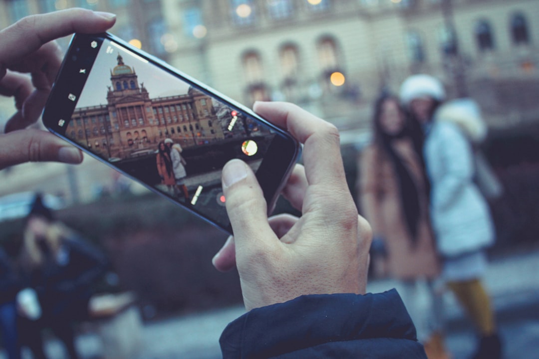 person holding black android smartphone