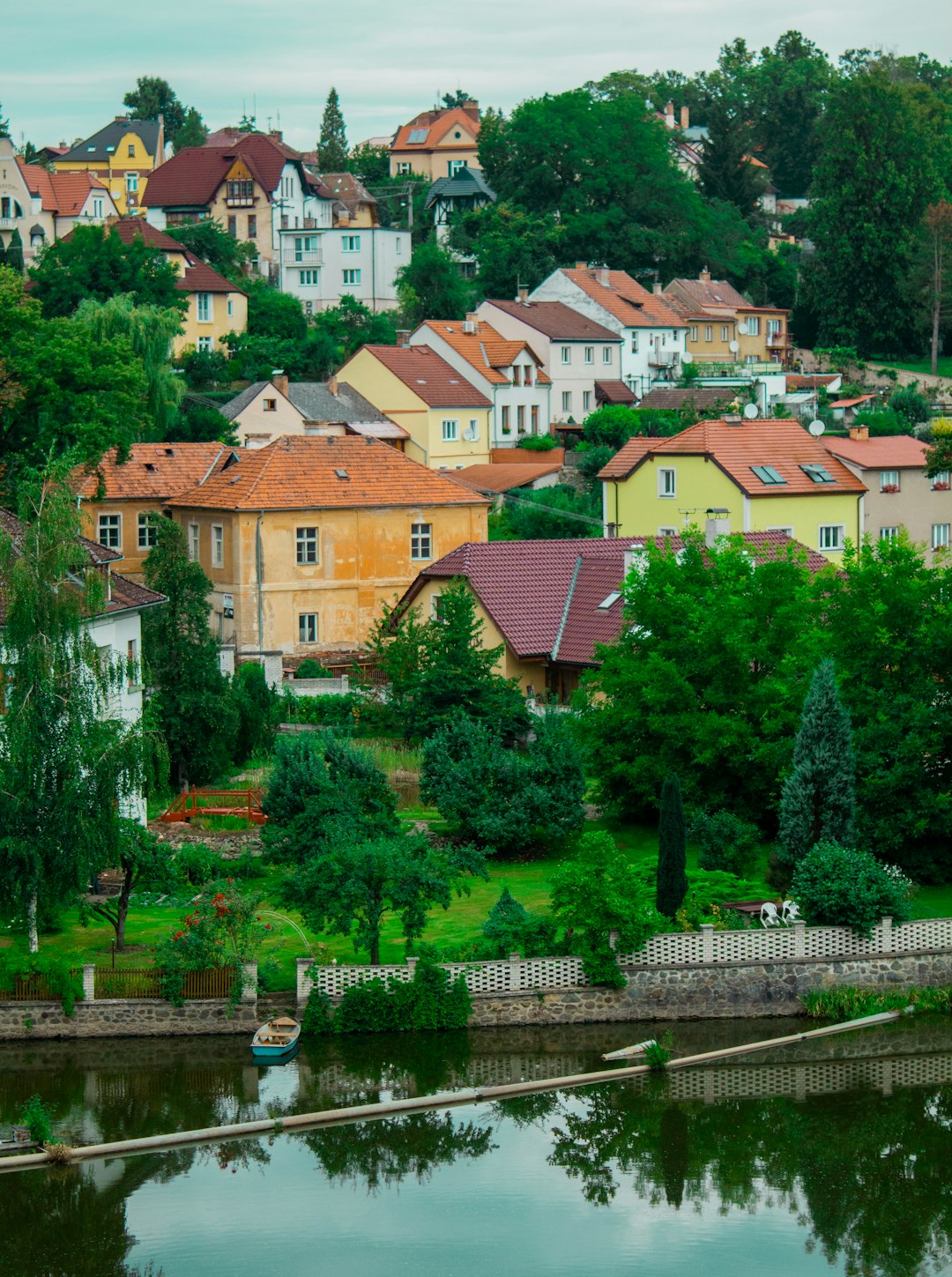 green trees near brown and white concrete houses during daytime