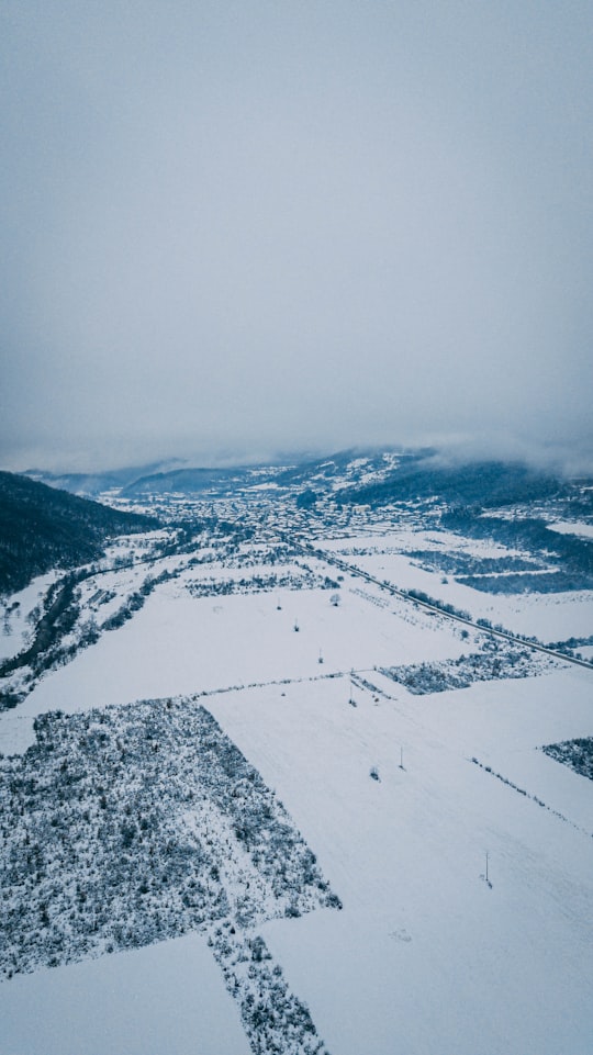 aerial view of snow covered mountains during daytime in Gavril Genovo Bulgaria