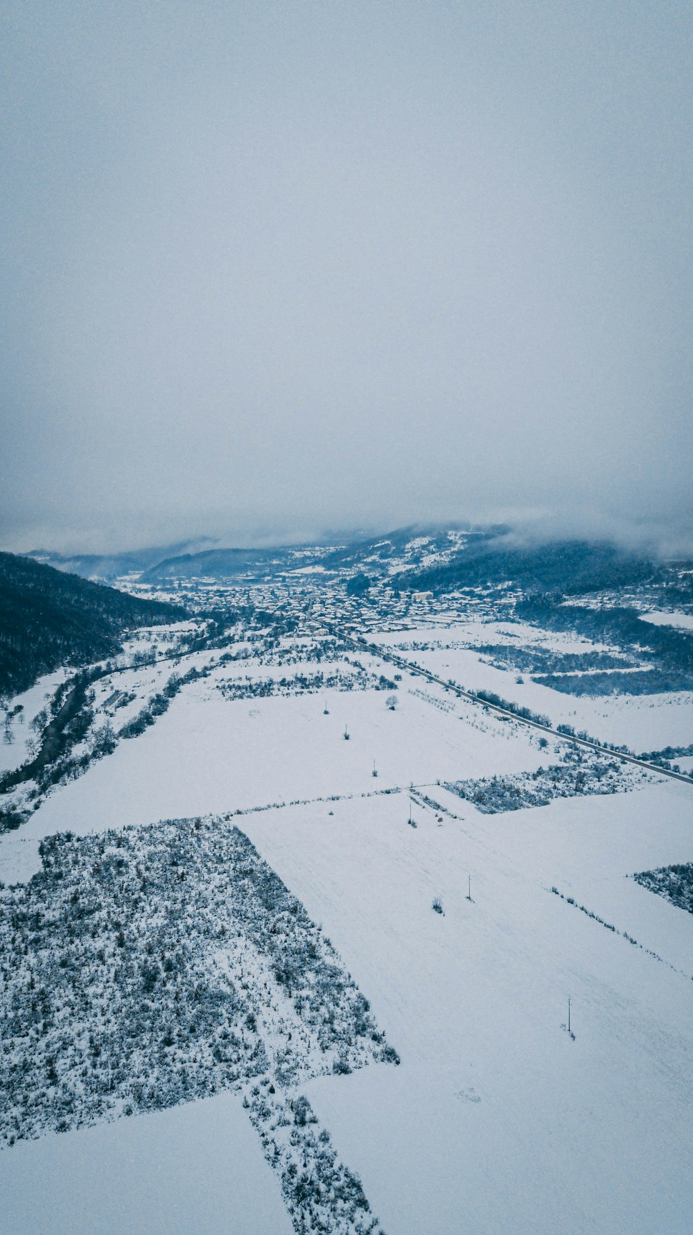 aerial view of snow covered mountains during daytime