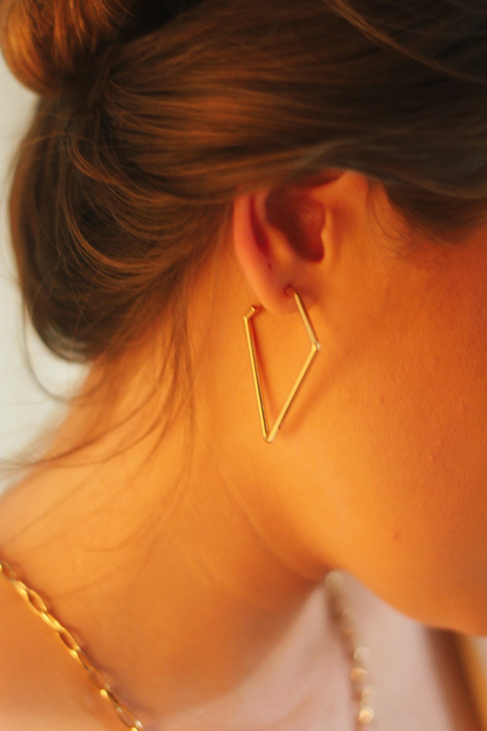 woman with gold hoop earrings