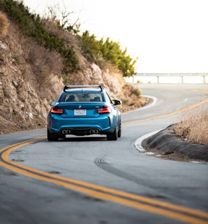 blue car on road during daytime