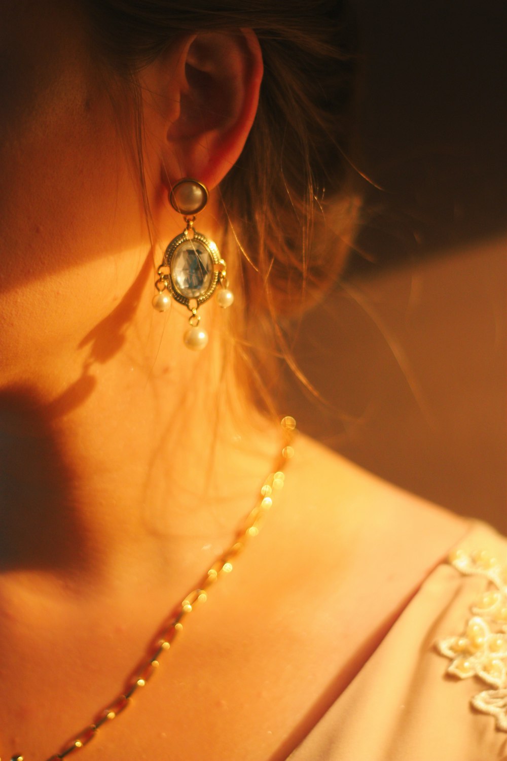 woman wearing silver and gold necklace