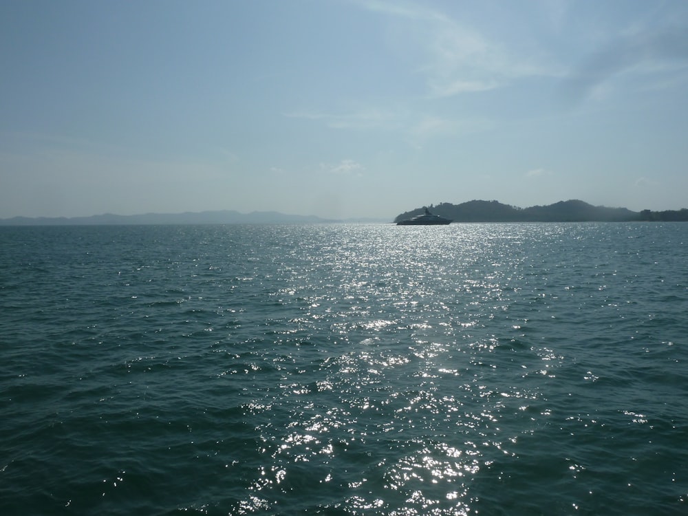 body of water under blue sky during daytime