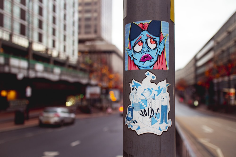 black white and blue panda graffiti on post