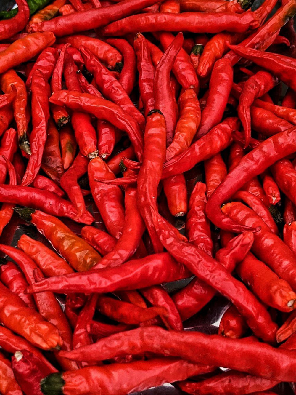 red chili peppers on white ceramic plate