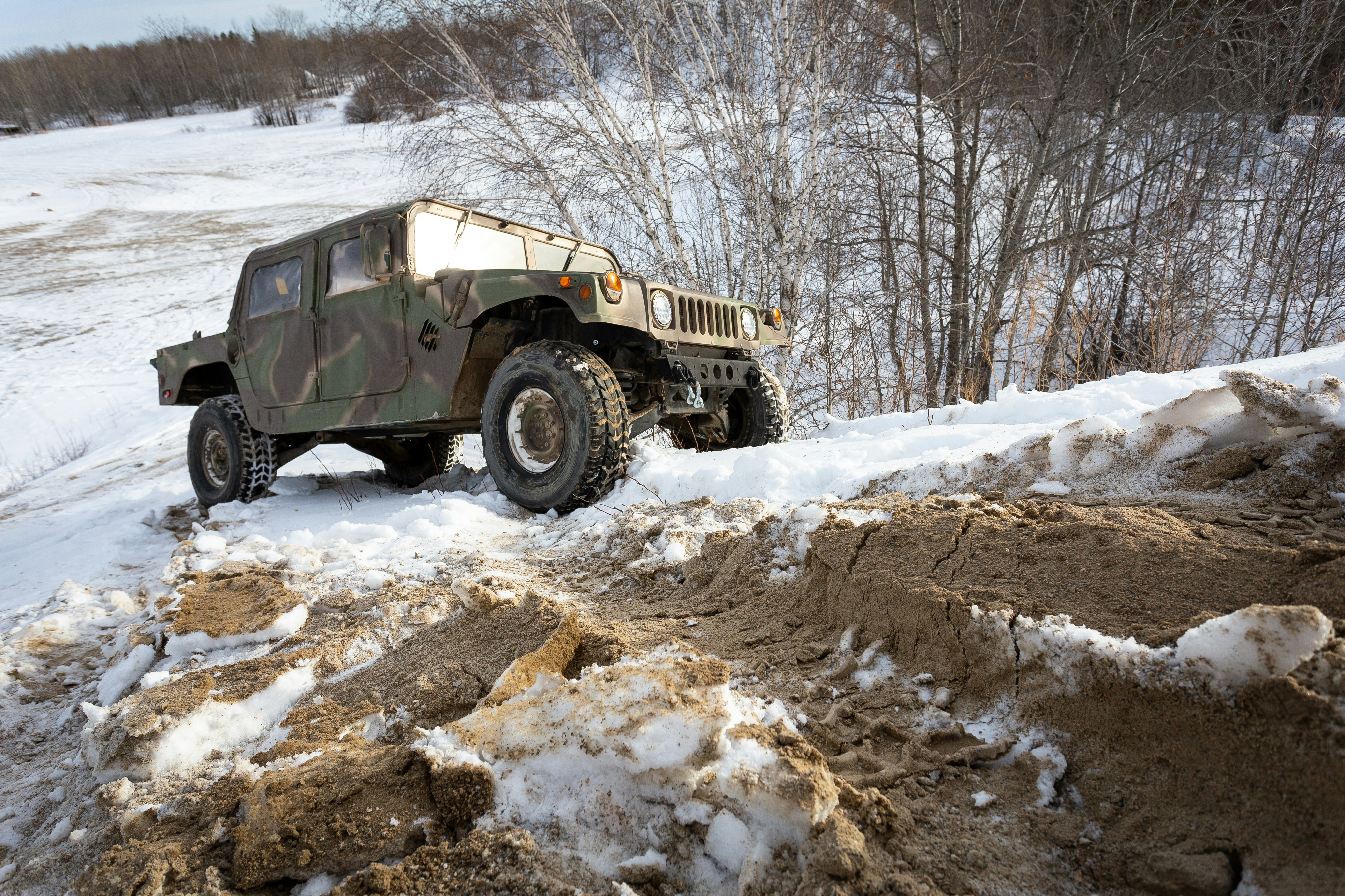 black and white jeep wrangler on snow covered ground during daytime