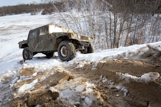 black and white jeep wrangler on snow covered ground during daytime