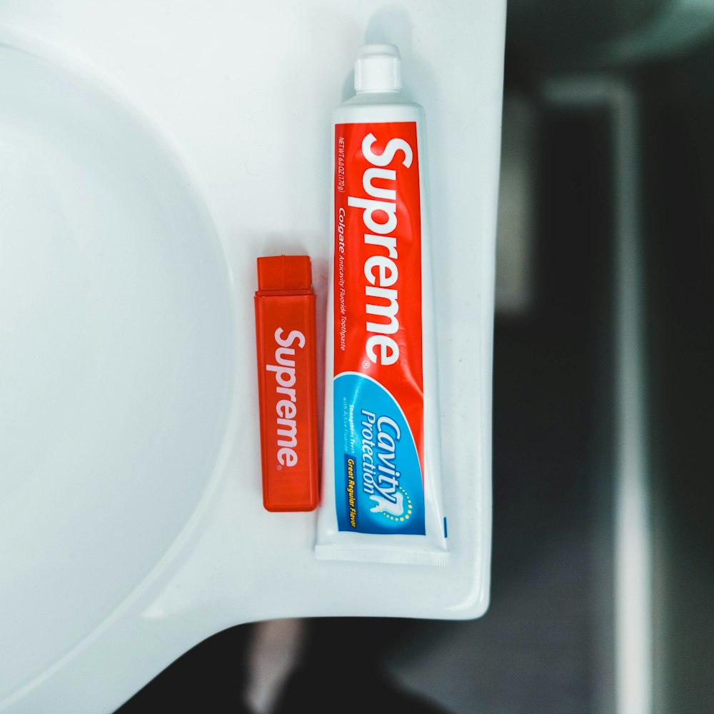 colgate toothpaste on white ceramic sink