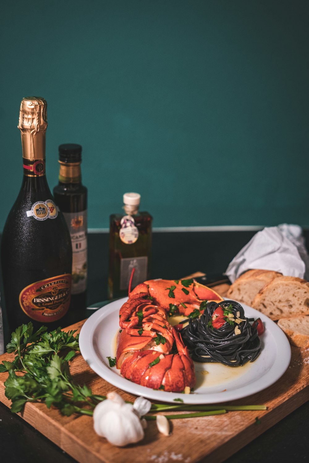 black wine bottle on white ceramic plate