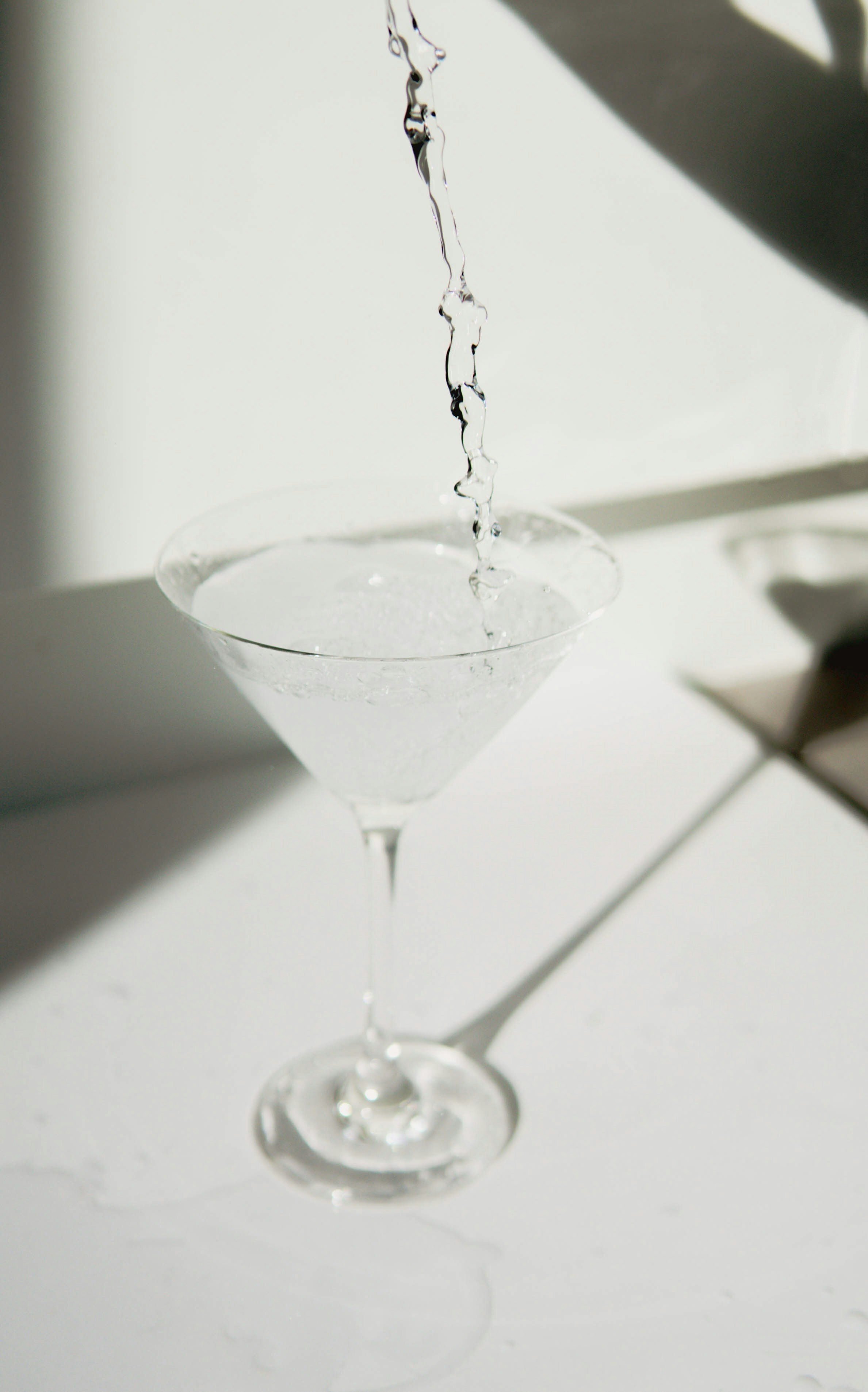 clear cocktail glass on white table