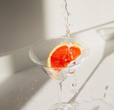 clear wine glass with orange liquid