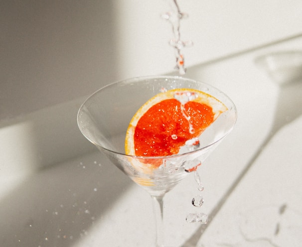 clear wine glass with orange liquid