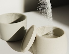 white ceramic bowl on white table