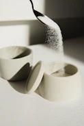white ceramic bowl on white table