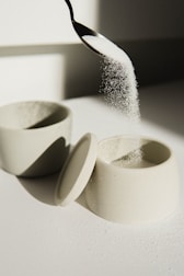 white ceramic bowl on white table