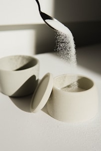 white ceramic bowl on white table