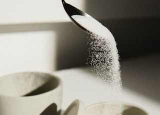 white ceramic bowl on white table