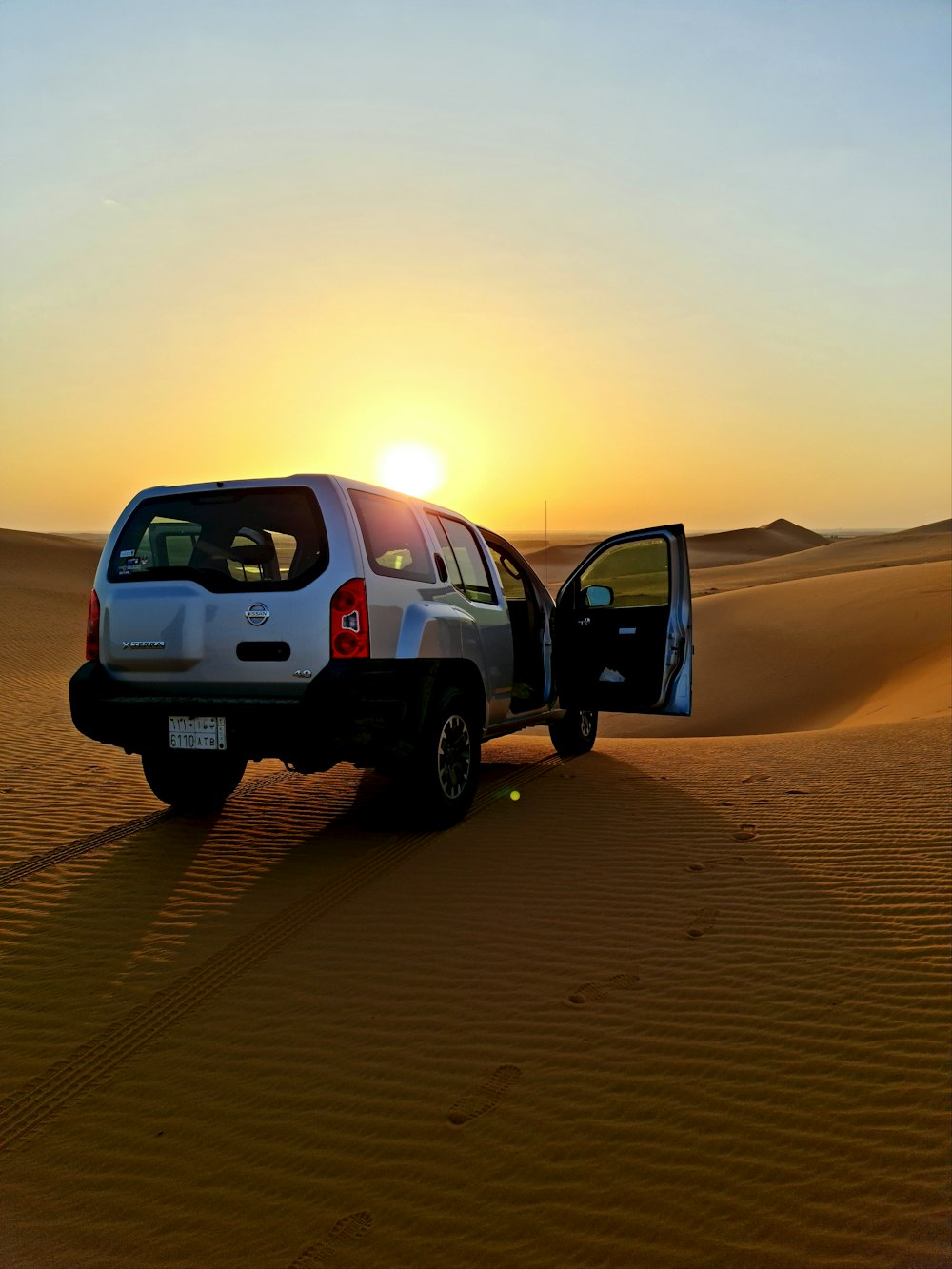 black suv on desert during daytime