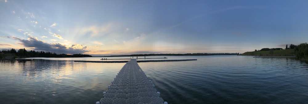 gray concrete bridge over body of water during daytime