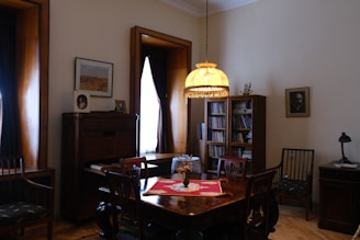 brown wooden dining table with chairs