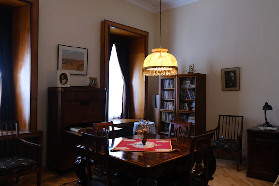 brown wooden dining table with chairs