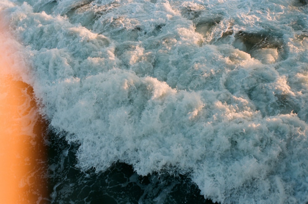 white and blue ocean waves