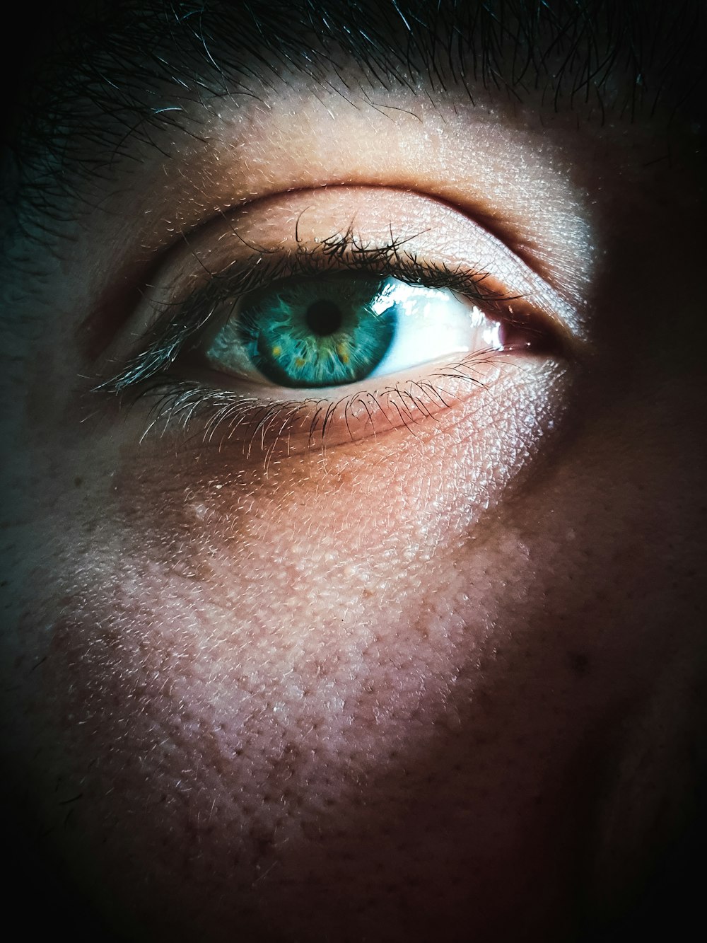 persons eye in close up photography