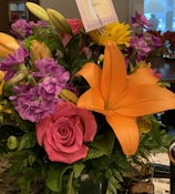 A vibrant bouquet of flowers with a QR code tag.