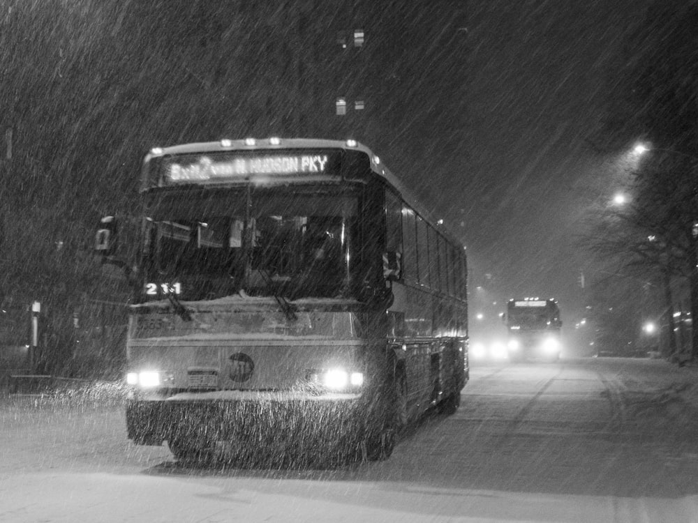 grayscale photo of bus on road