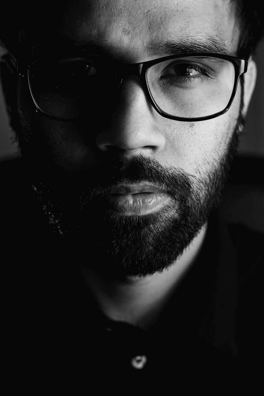 man wearing black framed eyeglasses