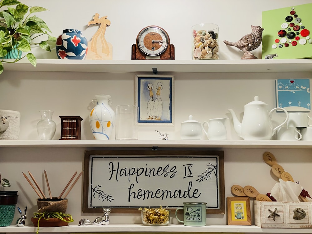 white ceramic teapot on white wooden shelf