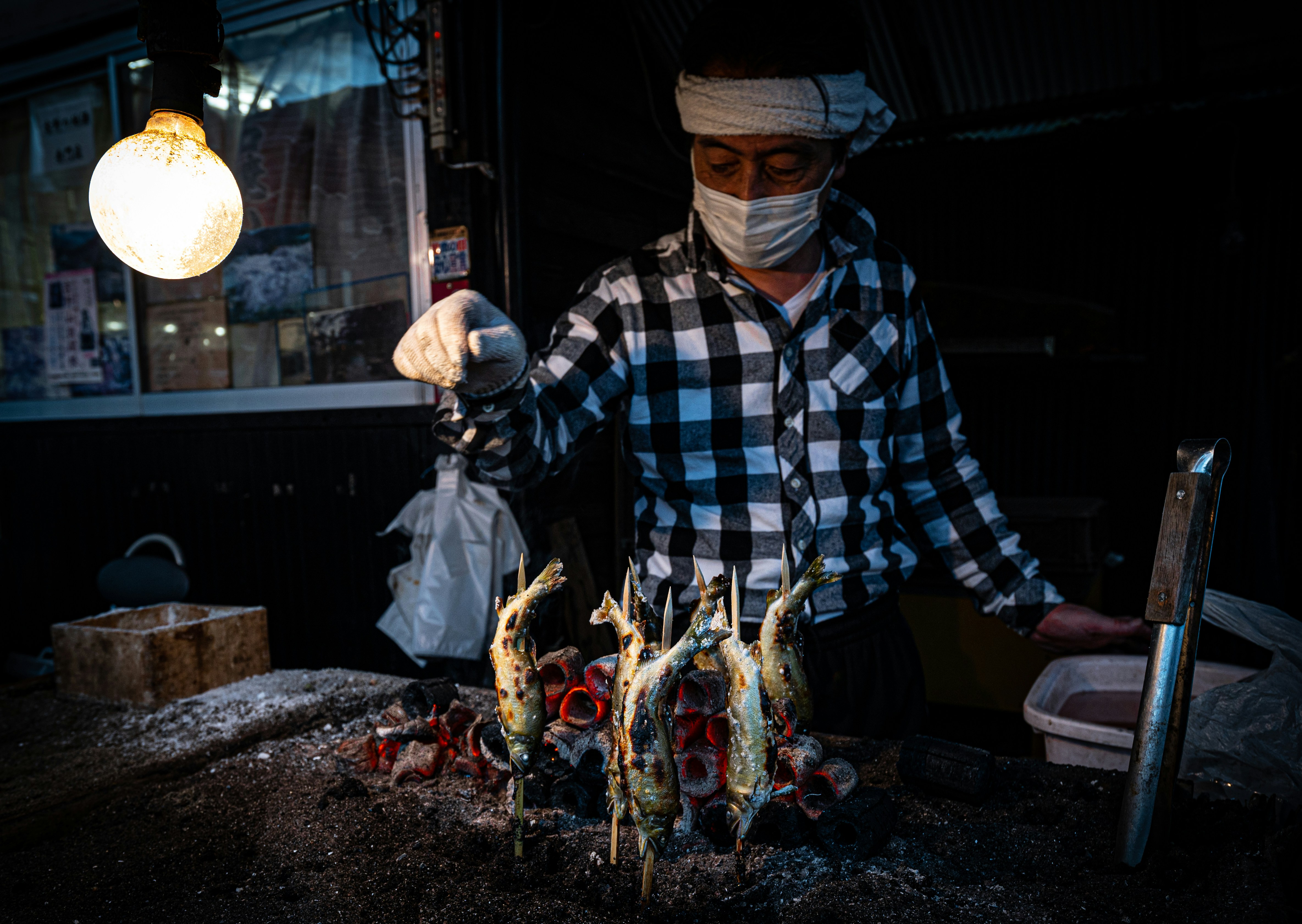 Person carefully refilling a kerosene heater's internal tank