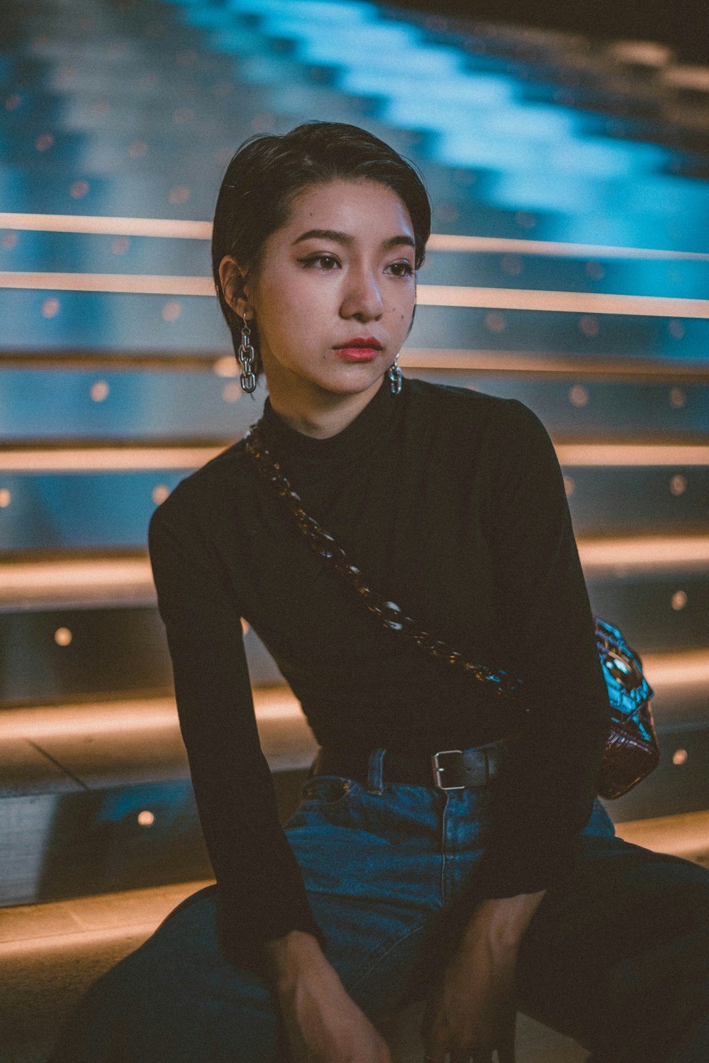 woman in black long sleeve shirt and blue denim jeans