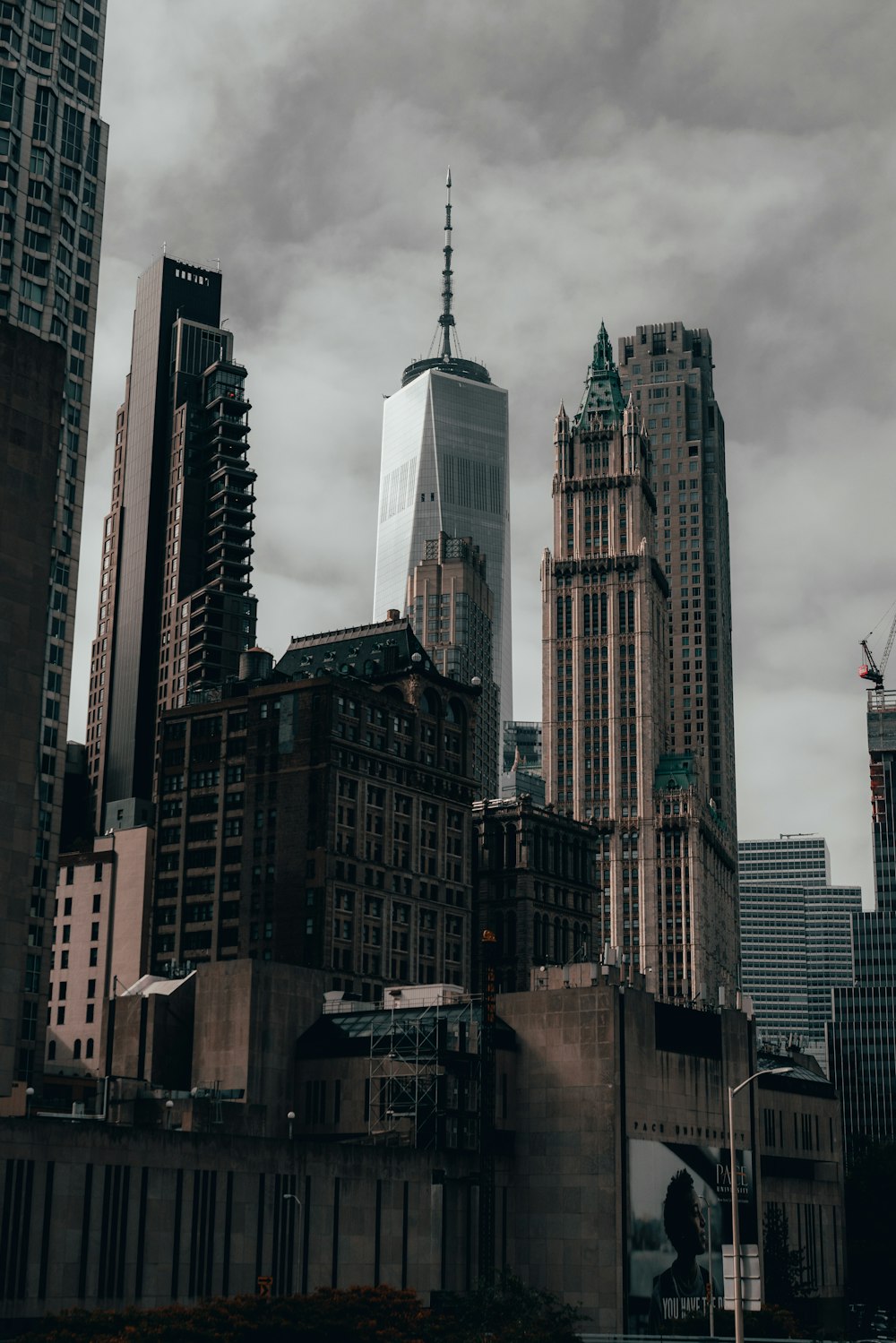 white and brown concrete building under gray clouds