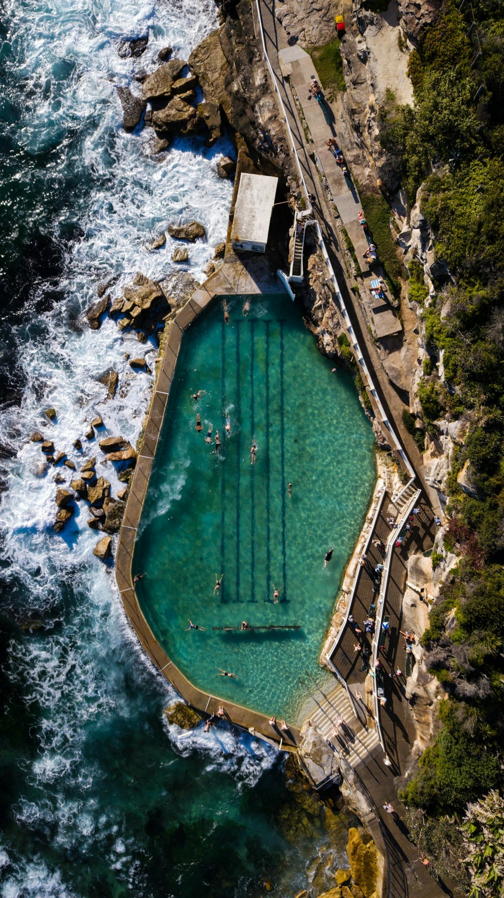 aerial view of green stadium near body of water during daytime