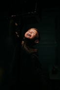 A warm, glowing light illuminating a child’s joyful face in a supportive environment